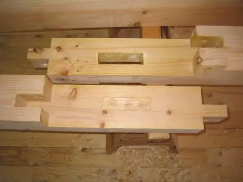 A wooden beam sitting on top of a floor.