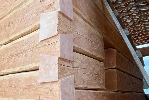 A close up of some wood in the corner