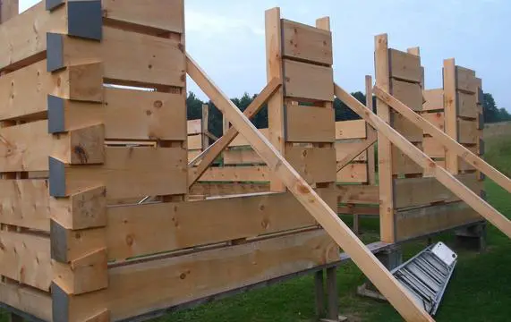 A wooden fence that has been cut in half.