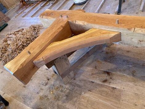 A wooden table with some wood pieces on it