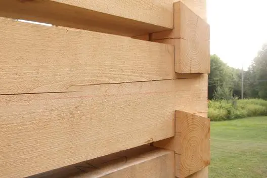 A close up of the wood planks on a fence.