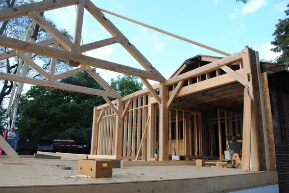 A building under construction with wood framing.